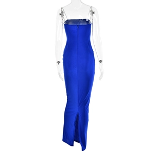Detail view of the back of a slim fit blue maxi dress with high waist and back slit