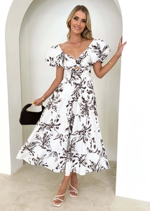 Detail of V-neck twist knot and puff sleeves on white floral print maxi dress