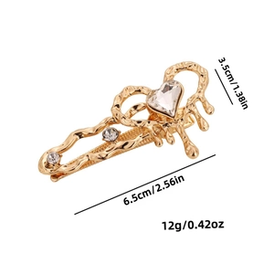 Golden heart moonstone hair clip with rhinestones and size dimensions shown on white background