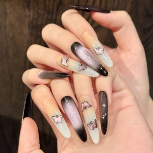 Extra long stiletto press-on nails with purple cat-eye glitter and butterfly design