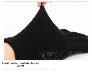 Close-up of flexible black knit fabric showing high elasticity and warm thermal texture