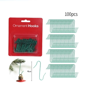 Detailed view of 100pcs 4cm green metal Christmas ornament hooks in package and on tree