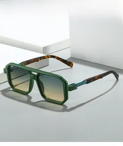 Detail view of square green frames with blue-yellow gradient lenses and tortoise temples