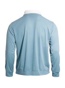 Detail view of light blue waffle knit shirt featuring white collar and ribbed cuffs