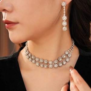 Close-up of elegant silver double-layer tassel necklace and matching diamond studs