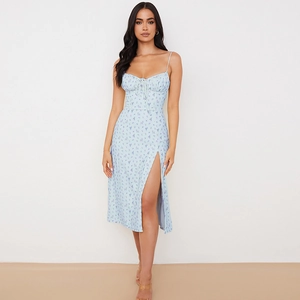 Detail of high side slit and light blue floral pattern on midi summer dress