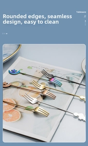 Detailed close-up of 304 stainless steel dessert forks with creative star and moon toppers
