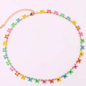 Detailed view of colorful enamel butterfly pendants on a gold chain with lobster clasp