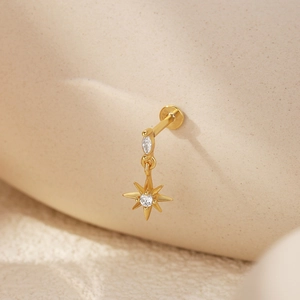 Detailed macro shot of a gold heart crown earring with 925 silver hallmark engraving