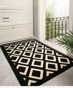 Detailed view of durable geometric entrance mat with non-slip texture on modern tile floor