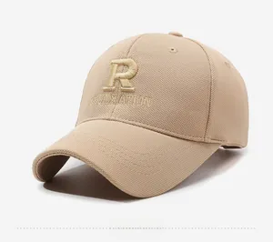Detail of 3D embroidered letter R and RELAXATION on a beige cotton baseball cap