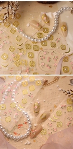 Detail of TL-438 nail stickers with golden window patterns, pink flowers and pearls