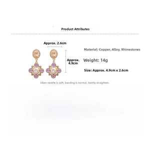 Detail view of vintage portrait earrings featuring colorful rhinestones and cross star design