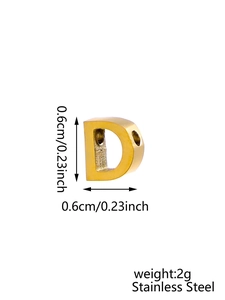 Macro detail of a 0.6cm golden stainless steel letter D pendant with size markings