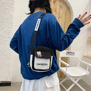 Japanese style black and white canvas crossbody bag for women with cute plush charm