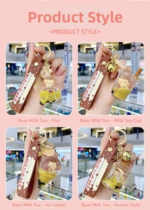 Detail of four creative bear bubble tea keychains with liquid floaters and star shapes