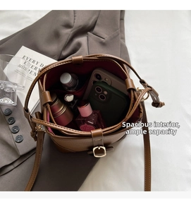 Top view showing the spacious interior of the brown bucket bag for daily essentials