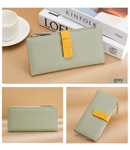 Detail of grey and yellow contrast long wallet in premium lychee grain leather texture