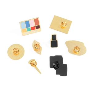 Set of 8 makeup themed enamel pins featuring eye shadow and lipstick in gold finish