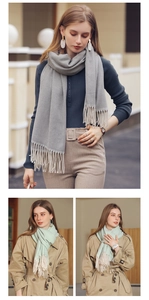 Detail of soft winter scarf featuring herringbone pattern and elegant fringe tassels