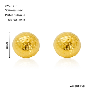 Detailed view of 20mm golf texture earrings in 18K gold plated stainless steel