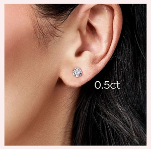 Close-up of 0.5ct moissanite stud earring worn by a model in 925 silver setting