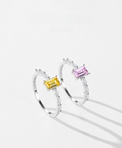 Detail of S925 sterling silver rings with pink and yellow square-cut cubic zirconia