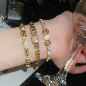 18K gold plated bangle set with zircon studs and woven texture on female wrist
