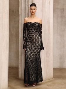 Detailed texture of black floral lace fabric on a long sleeve off-shoulder evening gown