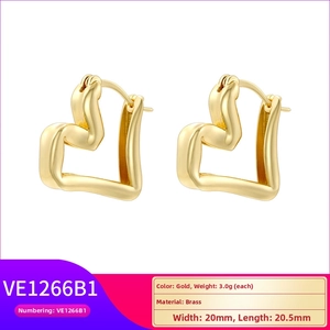 Detail shot of heart-shaped gold brass earrings showing 20mm x 20.5mm dimensions