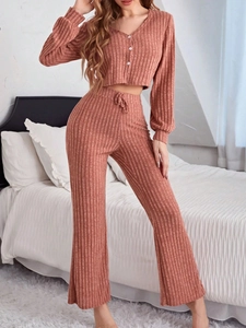 Detail of knit rib texture on long sleeve button cardigan and wide leg pajama pants