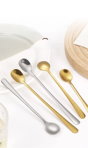 Detailed view of long handle stainless steel stir spoons with mirror polish finish
