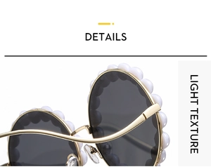 Detail of round sunglasses with elegant pearl-encrusted metal frame and dark lenses