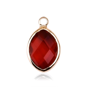 Detail of a red marquise-cut glass pendant in a gold metal frame with a top loop