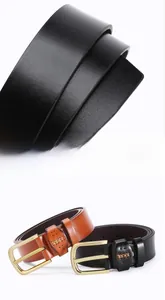 Detail of lychee textured leather belts with golden buckle and fine stitching
