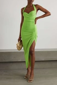 Detail of lime green halter dress featuring side ruched seams and a high slit design
