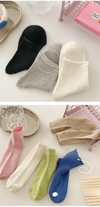 Detail of rolled cuff design and high elasticity fabric on colorful cotton socks
