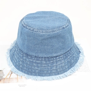 Light blue denim bucket hat with frayed edges and minimalist vintage wash for sun protection