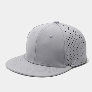 Detail view of grey snapback cap featuring breathable laser-cut side ventilation holes