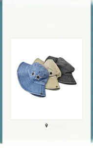 Detail of star-shaped patch embroidery on denim and cotton bucket hats in three colors