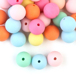 Macro shot of colorful matte round beads for DIY bracelet making and handmade jewelry