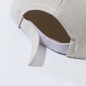 Adjustable beige cotton baseball cap with secure velcro closure and durable twill texture