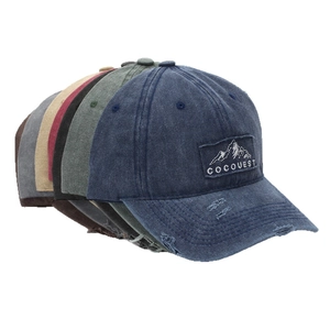 Unisex washed cotton baseball caps with Cocquest mountain embroidery and distressed details