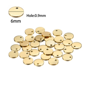 Detailed macro view of 6mm golden stainless steel round tags with 0.9mm hole size
