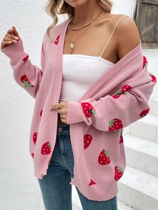 Pink knit cardigan with strawberry patterns and long sleeves in a loose casual style