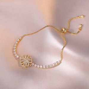 Golden clover bracelet with white zircon stones and adjustable drawstring chain