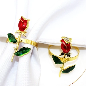 Rose napkin ring with red enamel flower and green leaves on gold metal band