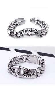 Detailed macro view of heavy vintage stainless steel bracelet with tribal engraving