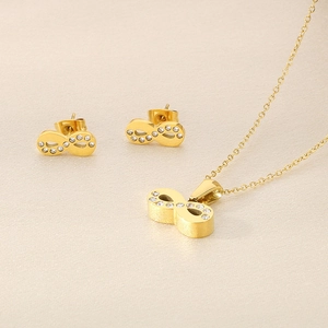 Close-up of 18k gold plated infinity necklace and earrings with sparkling crystals