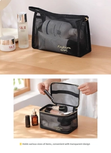 Detail of black mesh makeup bag with Fashion Girl embroidery and spacious storage